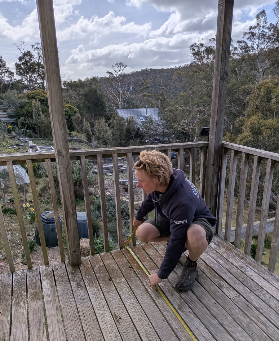 An elevated timber deck overlooking bushland in the Hobart hills