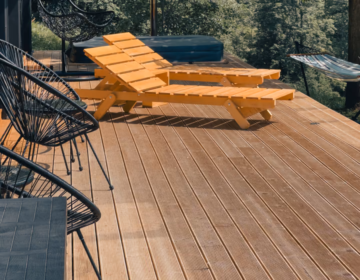 A modern timber deck with built-in lounge seating