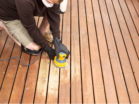 Sanding back a weathered timber deck