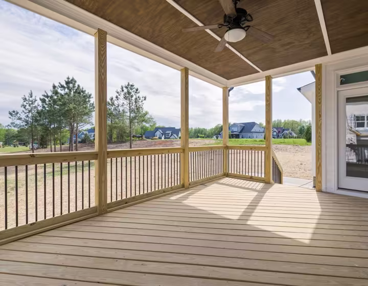 A covered timber deck with a pergola roof, ready for outdoor living